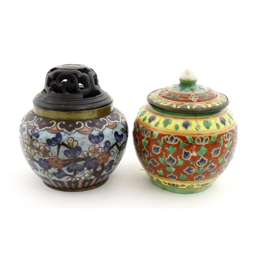 1034 - A small Oriental cloisonne pot with floral and foliate decoration. Together with a small Chinese cer... 