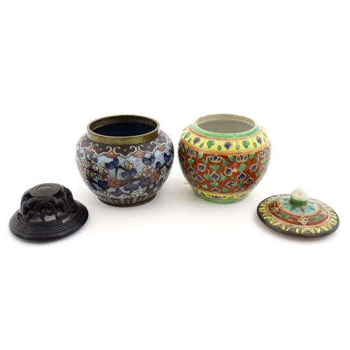 1034 - A small Oriental cloisonne pot with floral and foliate decoration. Together with a small Chinese cer... 