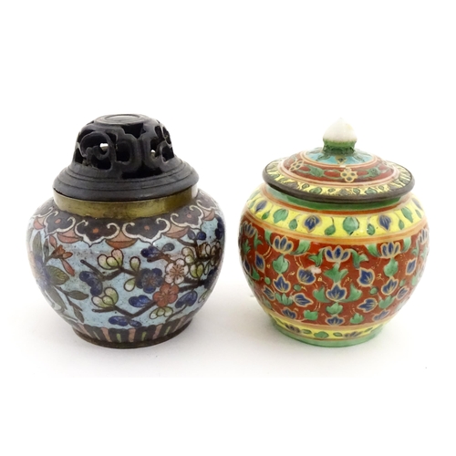 1034 - A small Oriental cloisonne pot with floral and foliate decoration. Together with a small Chinese cer... 