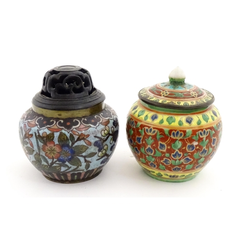 1034 - A small Oriental cloisonne pot with floral and foliate decoration. Together with a small Chinese cer... 