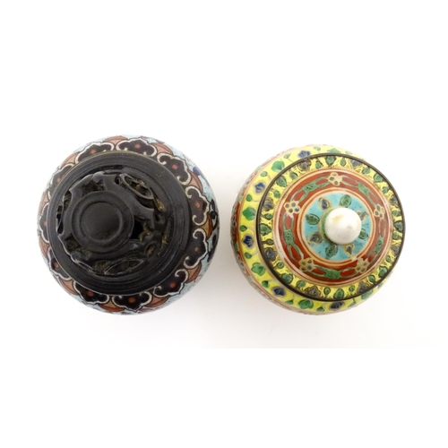 1034 - A small Oriental cloisonne pot with floral and foliate decoration. Together with a small Chinese cer... 