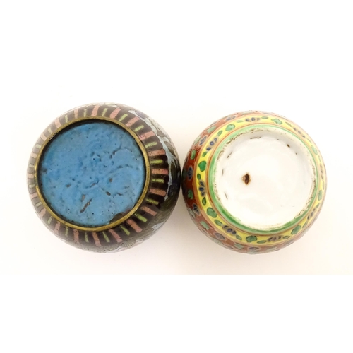 1034 - A small Oriental cloisonne pot with floral and foliate decoration. Together with a small Chinese cer... 