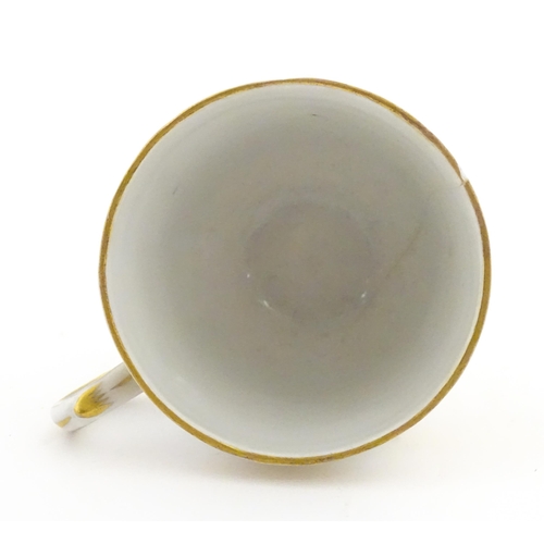 222 - Two Polish Korzec tea cups and saucers with hand painted decoration depicting 18thC Infantry soldier... 