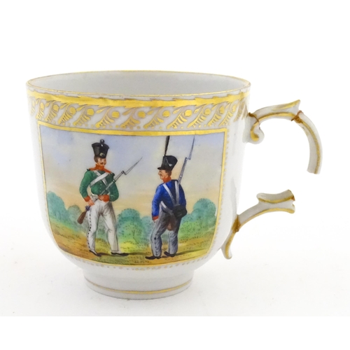 222 - Two Polish Korzec tea cups and saucers with hand painted decoration depicting 18thC Infantry soldier... 