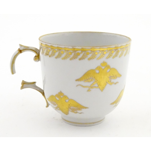 222 - Two Polish Korzec tea cups and saucers with hand painted decoration depicting 18thC Infantry soldier... 