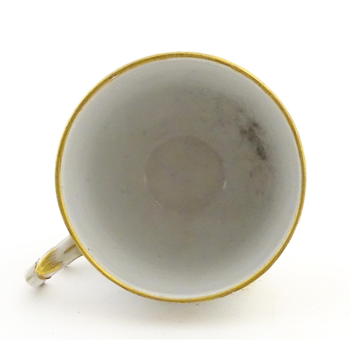 222 - Two Polish Korzec tea cups and saucers with hand painted decoration depicting 18thC Infantry soldier... 