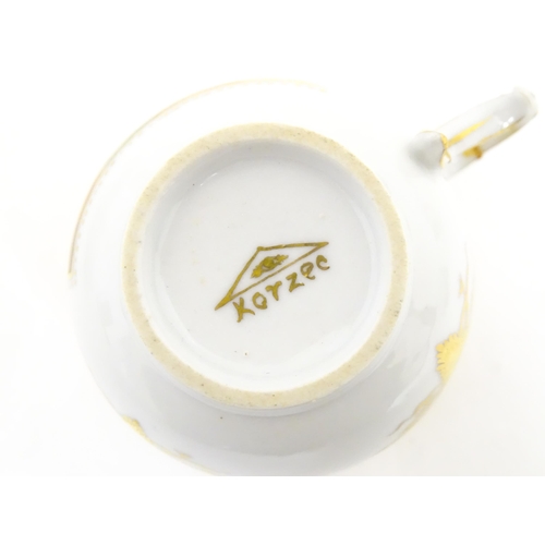 222 - Two Polish Korzec tea cups and saucers with hand painted decoration depicting 18thC Infantry soldier... 