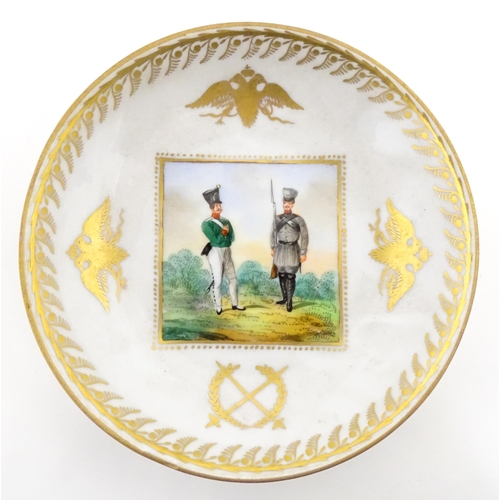 222 - Two Polish Korzec tea cups and saucers with hand painted decoration depicting 18thC Infantry soldier... 