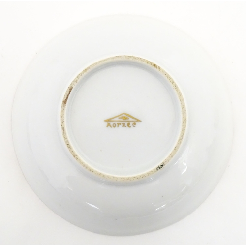 222 - Two Polish Korzec tea cups and saucers with hand painted decoration depicting 18thC Infantry soldier... 