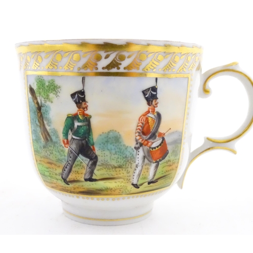 222 - Two Polish Korzec tea cups and saucers with hand painted decoration depicting 18thC Infantry soldier... 