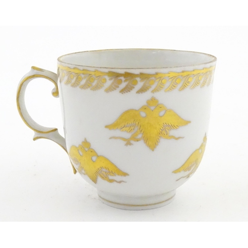 222 - Two Polish Korzec tea cups and saucers with hand painted decoration depicting 18thC Infantry soldier... 