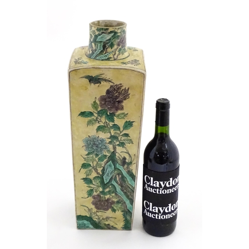 226 - A Chinese vase of squared form with a yellow ground decorated with blossom, peonies, lotus leaves, b... 