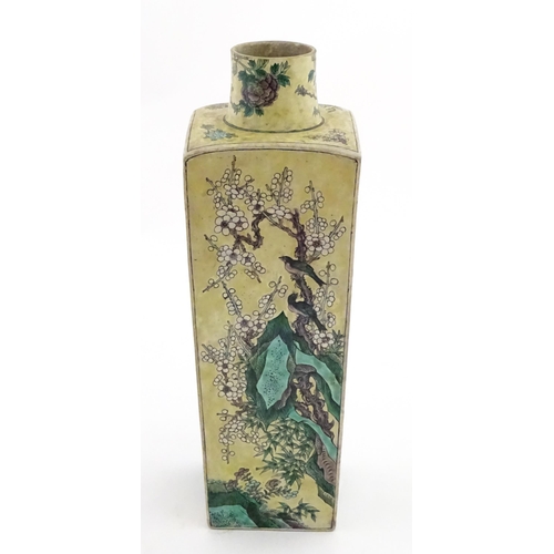 226 - A Chinese vase of squared form with a yellow ground decorated with blossom, peonies, lotus leaves, b... 