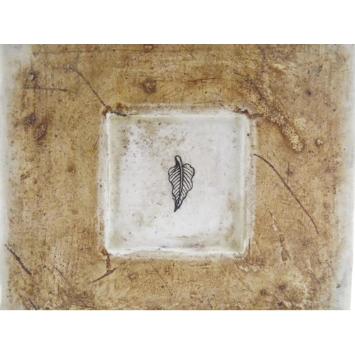 226 - A Chinese vase of squared form with a yellow ground decorated with blossom, peonies, lotus leaves, b... 