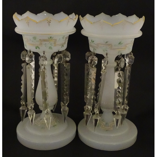 303 - Two Victorian opaque glass table lustres with gilt detail and glass lustre drops. Approx. 12 3/4