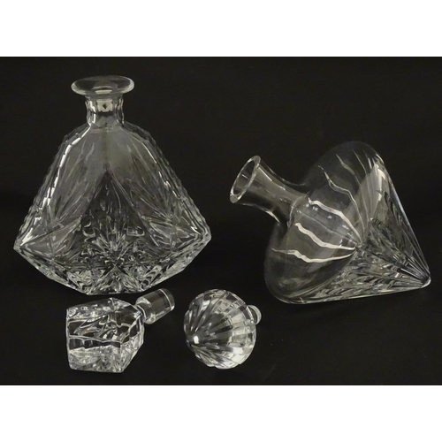 310 - A Stuart Crystal tilted decanter. Together with a Thomas Webb cut crystal decanter. Largest approx. ... 