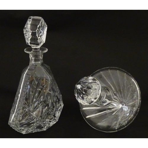 310 - A Stuart Crystal tilted decanter. Together with a Thomas Webb cut crystal decanter. Largest approx. ... 