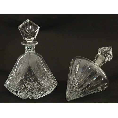 310 - A Stuart Crystal tilted decanter. Together with a Thomas Webb cut crystal decanter. Largest approx. ... 