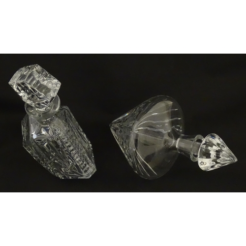 310 - A Stuart Crystal tilted decanter. Together with a Thomas Webb cut crystal decanter. Largest approx. ... 