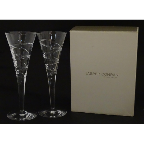 319 - A boxed pair of Jasper Conran for Stuart Crystal champagne glasses / flutes. Each approx. 10 1/4