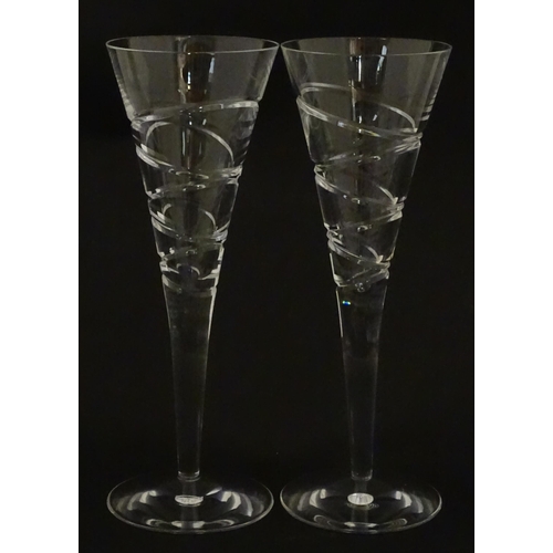 319 - A boxed pair of Jasper Conran for Stuart Crystal champagne glasses / flutes. Each approx. 10 1/4