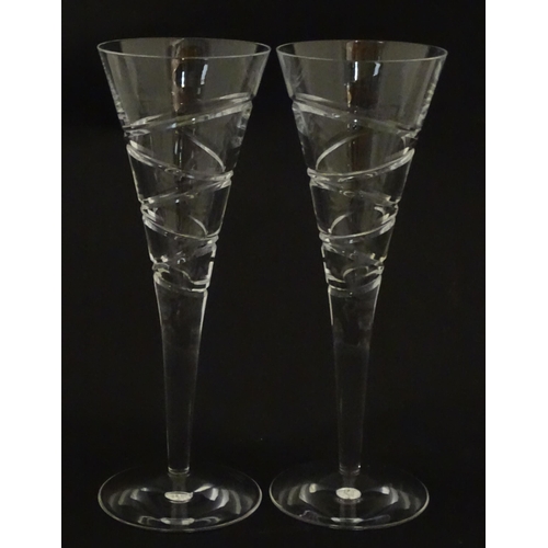 319 - A boxed pair of Jasper Conran for Stuart Crystal champagne glasses / flutes. Each approx. 10 1/4