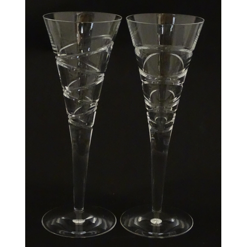 319 - A boxed pair of Jasper Conran for Stuart Crystal champagne glasses / flutes. Each approx. 10 1/4