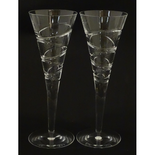 319 - A boxed pair of Jasper Conran for Stuart Crystal champagne glasses / flutes. Each approx. 10 1/4
