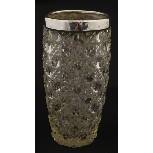 324 - A cut glass vase with silver rim hallmarked London 1902, maker Henry Perkins & Sons. Approx. 7 3/4