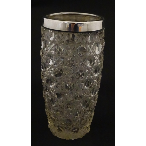 324 - A cut glass vase with silver rim hallmarked London 1902, maker Henry Perkins & Sons. Approx. 7 3/4