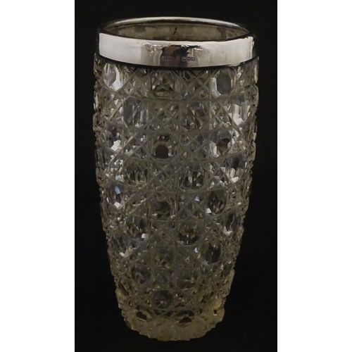 324 - A cut glass vase with silver rim hallmarked London 1902, maker Henry Perkins & Sons. Approx. 7 3/4