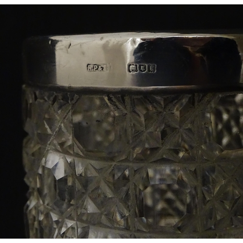 324 - A cut glass vase with silver rim hallmarked London 1902, maker Henry Perkins & Sons. Approx. 7 3/4