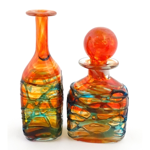 327 - Two Mdina orange glass items with blue trail detail comprising bottle vase and decanter. Largest app... 