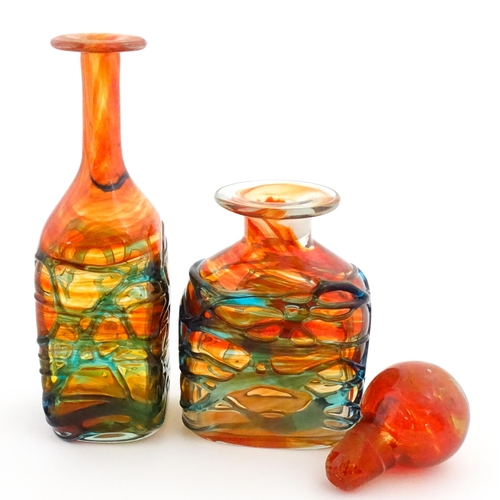 327 - Two Mdina orange glass items with blue trail detail comprising bottle vase and decanter. Largest app... 