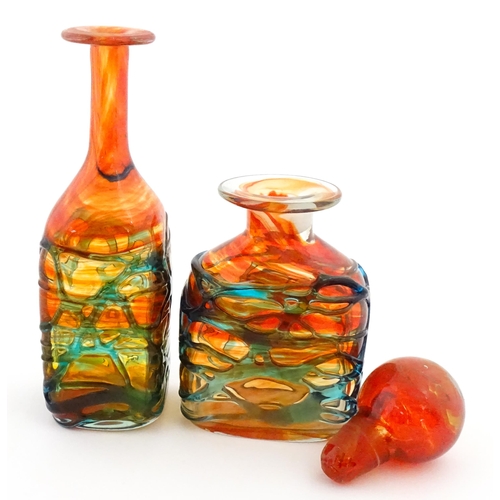 327 - Two Mdina orange glass items with blue trail detail comprising bottle vase and decanter. Largest app... 