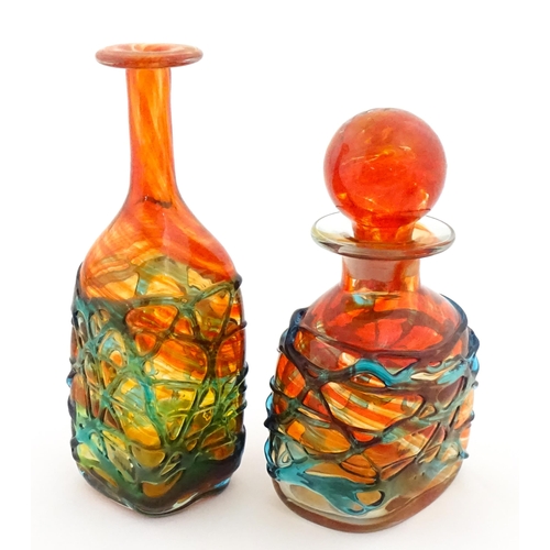 327 - Two Mdina orange glass items with blue trail detail comprising bottle vase and decanter. Largest app... 