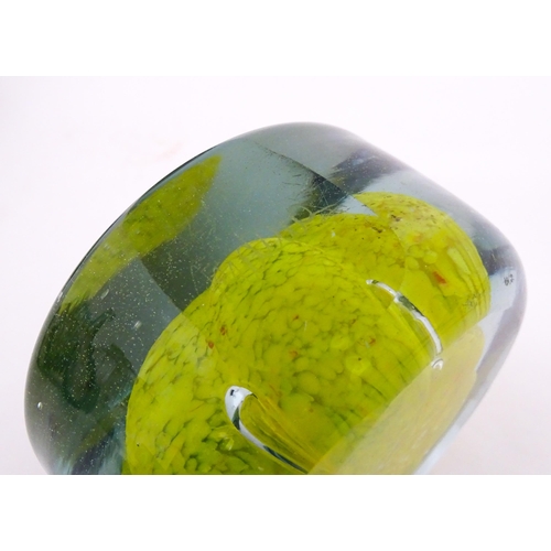 331 - Two Mdina glass paperweights with flower detail. Both signed under. Largest approx. 4 1/2