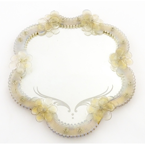 333 - An Italian / Venetian Murano framed mirror with applied glass flower detail. Approx. 13 1/2