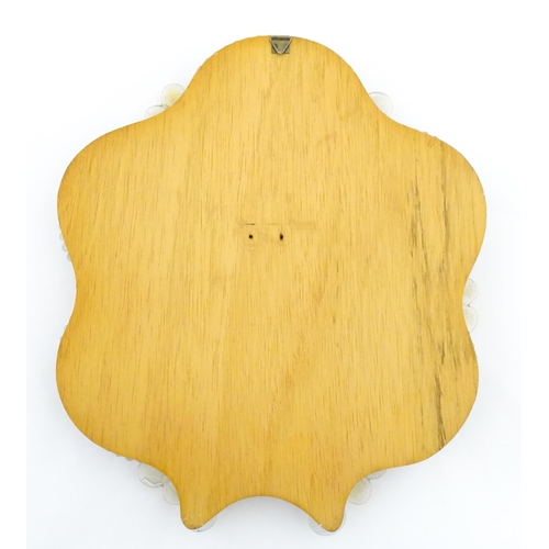 333 - An Italian / Venetian Murano framed mirror with applied glass flower detail. Approx. 13 1/2