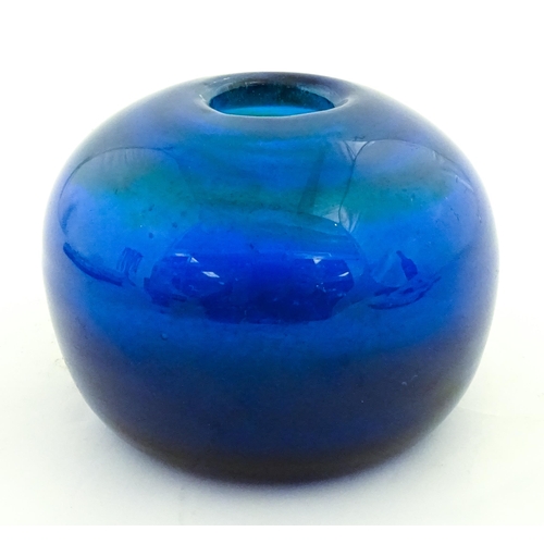 334 - A Mdina blue glass inside out vase of squat form. Approx. 3 1/2