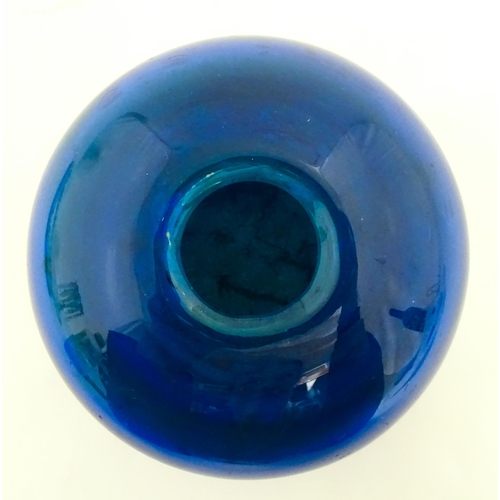 334 - A Mdina blue glass inside out vase of squat form. Approx. 3 1/2
