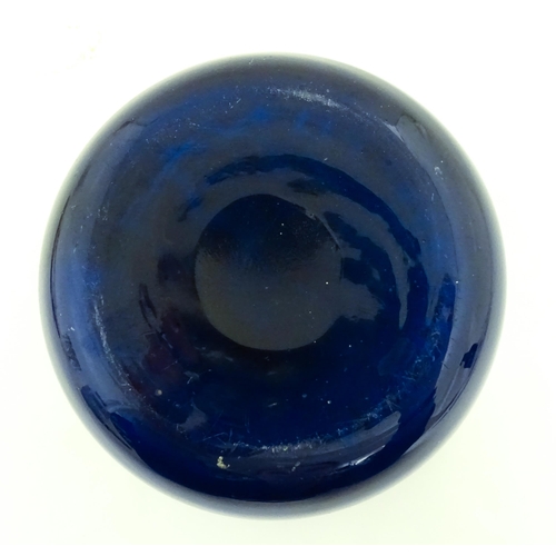 334 - A Mdina blue glass inside out vase of squat form. Approx. 3 1/2