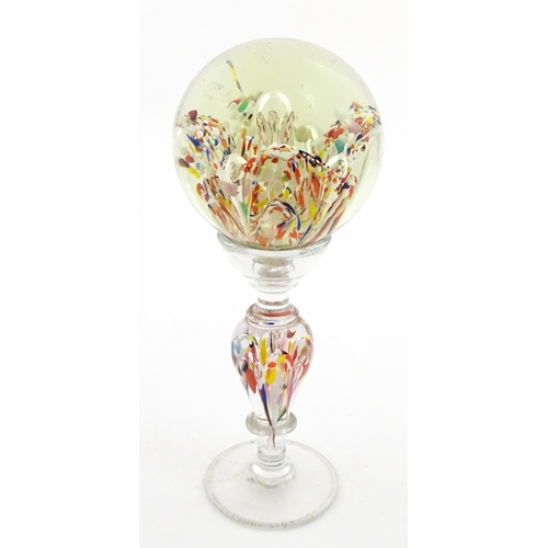 337 - A glass pedestal paperweight / wig stand. Approx. 9 1/2