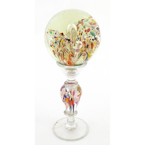 337 - A glass pedestal paperweight / wig stand. Approx. 9 1/2