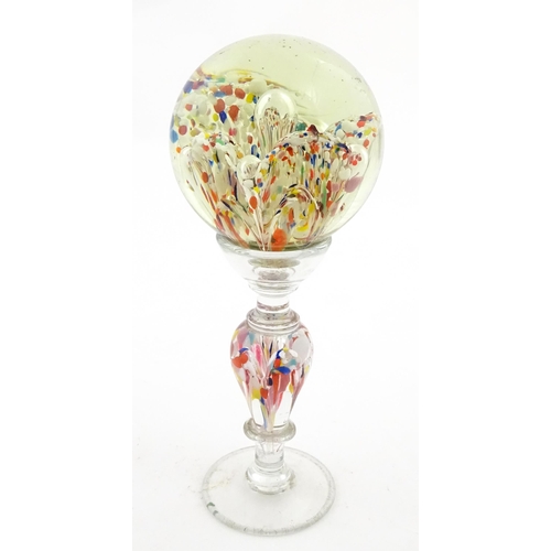 337 - A glass pedestal paperweight / wig stand. Approx. 9 1/2