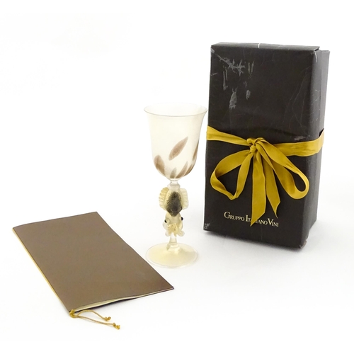 338 - An Italian Maria Grazia Rosin 'Cuttlefish' blown glass wine glass with fish detail to stem. Boxed. A... 