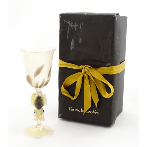 338 - An Italian Maria Grazia Rosin 'Cuttlefish' blown glass wine glass with fish detail to stem. Boxed. A... 