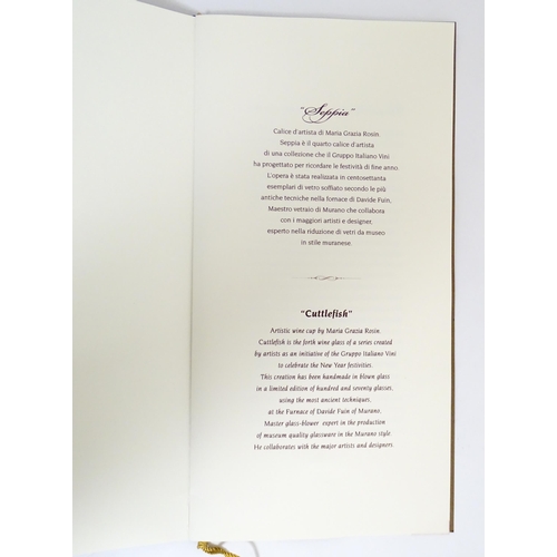 338 - An Italian Maria Grazia Rosin 'Cuttlefish' blown glass wine glass with fish detail to stem. Boxed. A... 