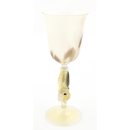 338 - An Italian Maria Grazia Rosin 'Cuttlefish' blown glass wine glass with fish detail to stem. Boxed. A... 