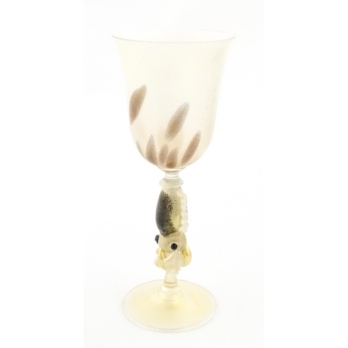 338 - An Italian Maria Grazia Rosin 'Cuttlefish' blown glass wine glass with fish detail to stem. Boxed. A... 